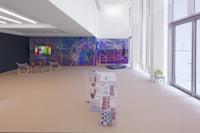 a room with a lot of art on the walls